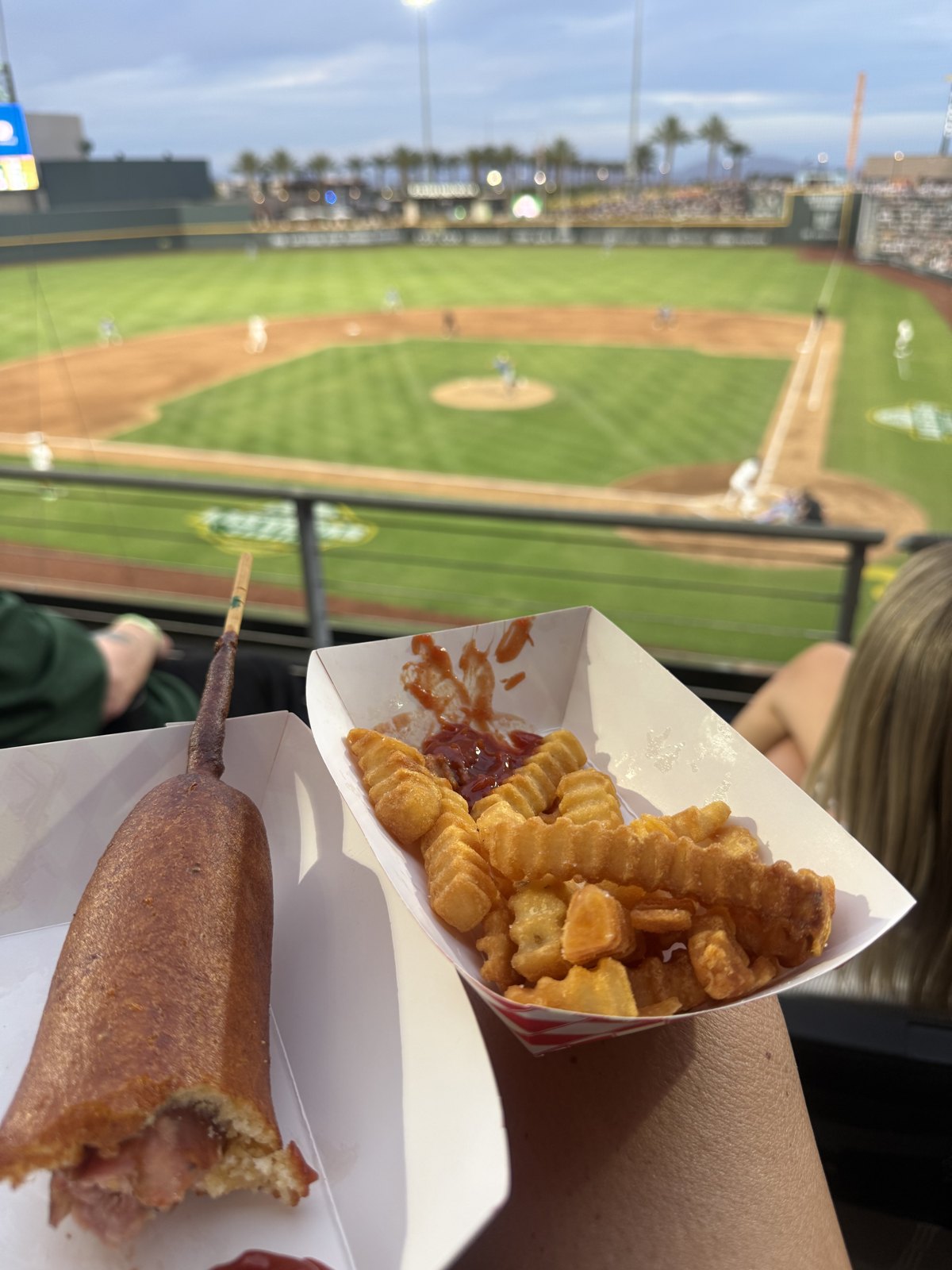 Game-day food in hand with the field behind it at Las Vegas Ballpark in Summerlin
