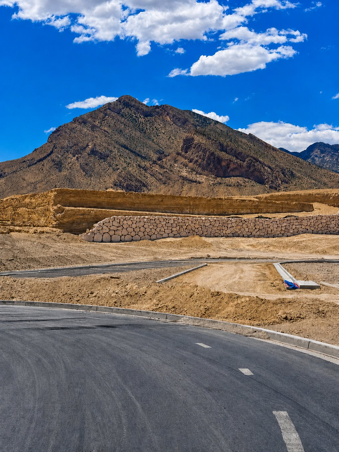 New construction grading at the base of the mountains in Summerlin West, Las Vegas, where relocating buyers research how Clark County property taxes are calculated at purchase