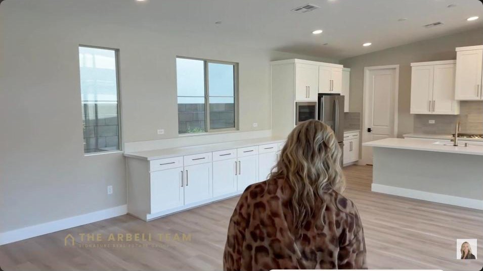 Open-concept great room and kitchen in a new construction Grand Park home in Summerlin