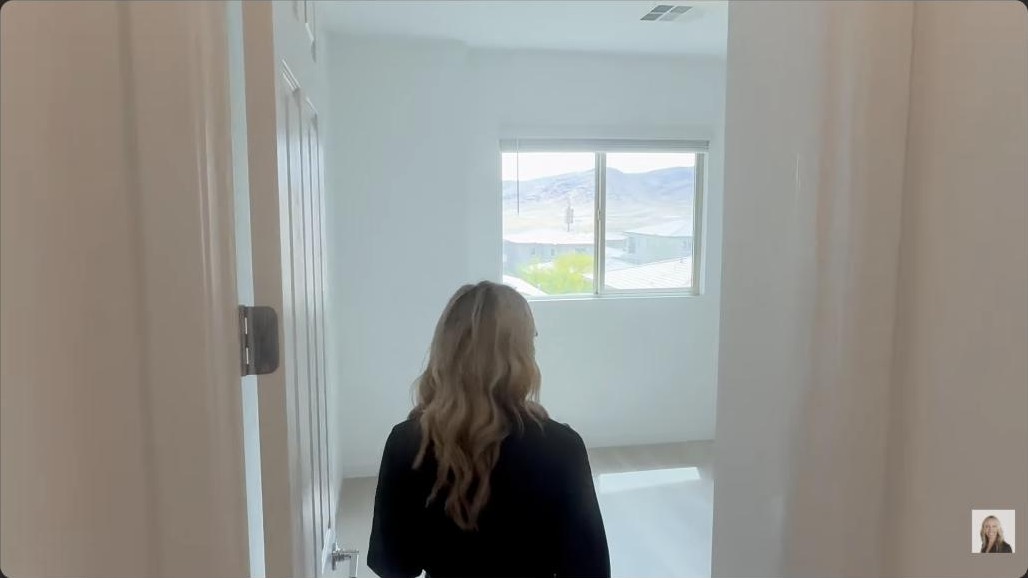 Primary bedroom with a mountain and valley view in a million dollar Summerlin home