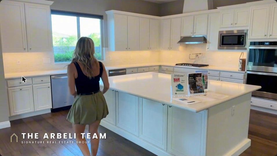 Gourmet kitchen with a large island and double dishwashers in a Summerlin West Toll Brothers home