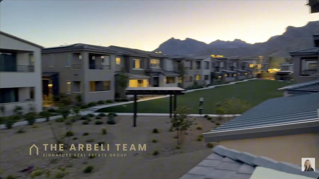 Balcony view of the Reverence community and mountains at dusk from a Summerlin townhome