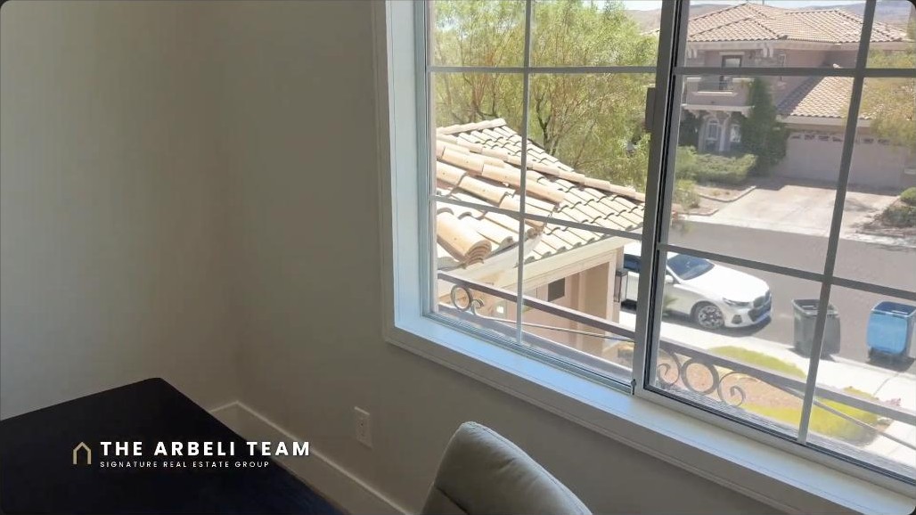 Private executive office hidden behind a custom Murphy door in a Summerlin West luxury home