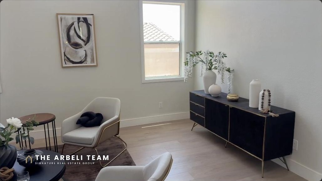 Staged formal living and entry sitting area in a renovated Summerlin West luxury home