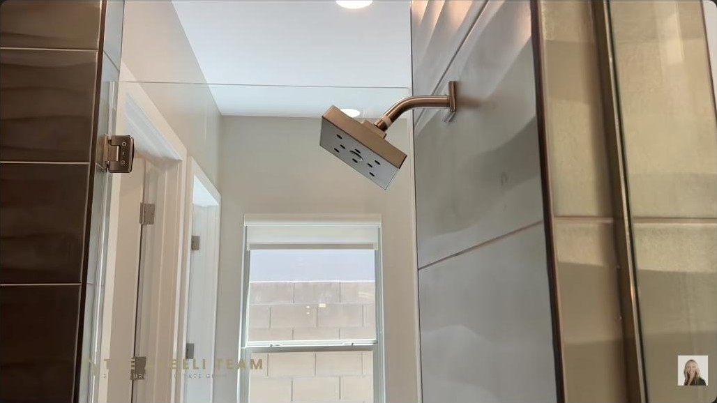 Primary suite luxury bath with a large tiled walk-in shower in a single-story Summerlin West home