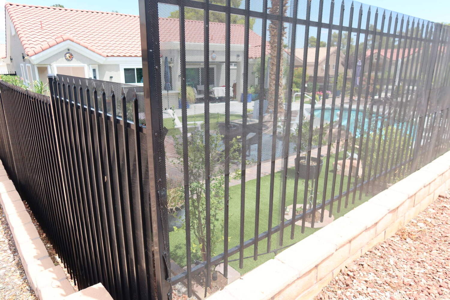 Private backyard pool behind a view fence in Sun City Summerlin, Las Vegas 55+ community