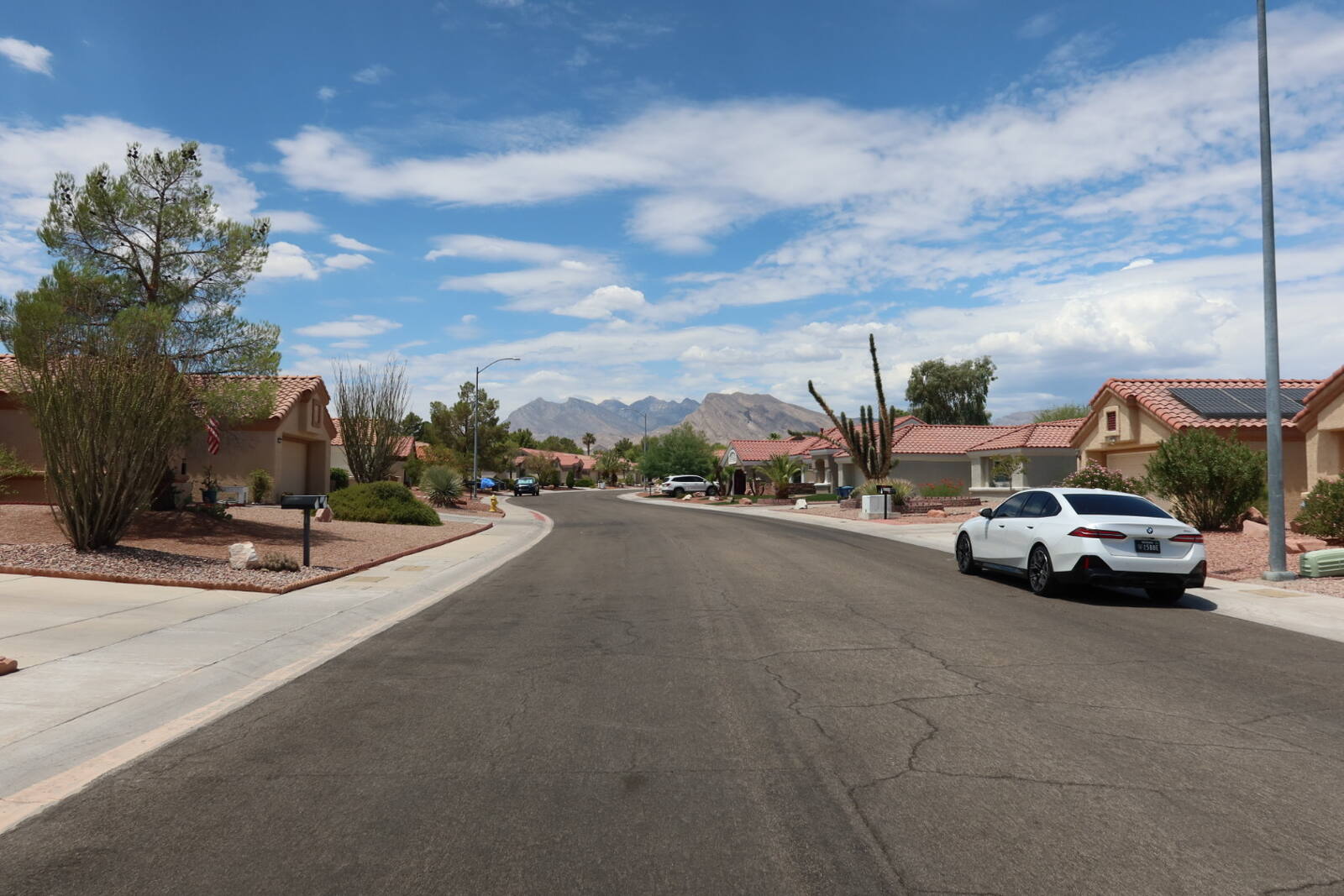 Quiet single-story residential street in Sun City Summerlin Las Vegas with mountain views