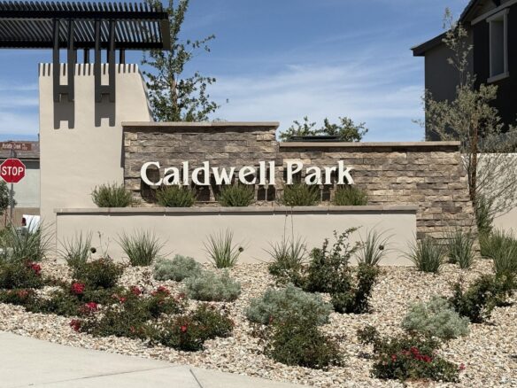 Stone and stucco entrance monument reading Caldwell Park at the KB Home community in Grand Park, Summerlin West, Las Vegas, Nevada