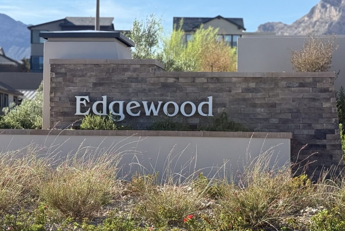 Stone and stucco entrance monument reading Edgewood at the Tri Pointe Homes neighborhood in the Grand Park village of Summerlin West, Las Vegas, Nevada 89138