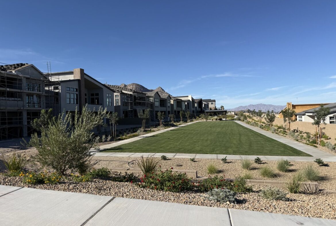 Landscaped common area greenbelt separating homes that back up to each other in Glenrock at Grand Park, Summerlin West, Las Vegas, Nevada 89138