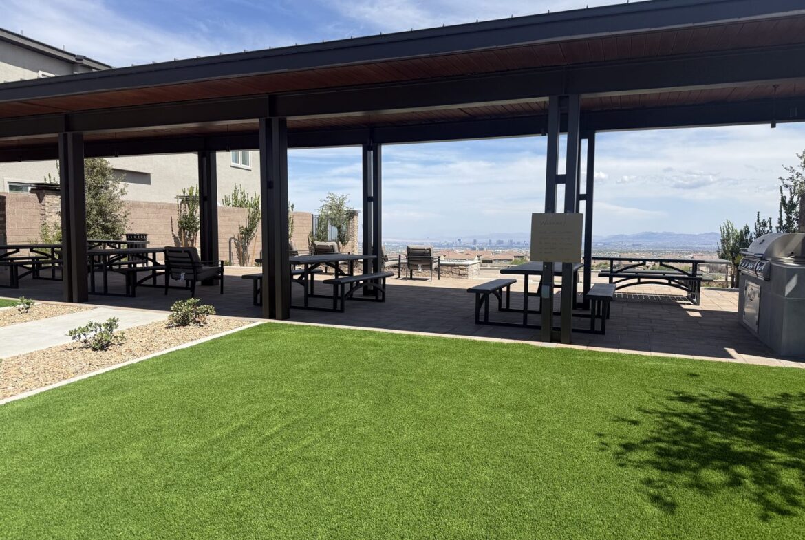 Covered ramada with picnic tables beside the lawn at the Glenrock common area in Grand Park, Summerlin West, Las Vegas, Nevada 89138