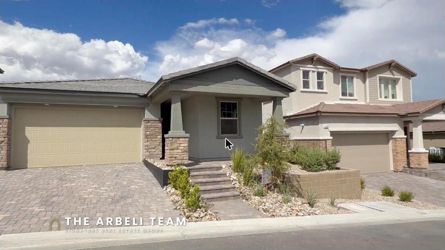 Single story new construction front exterior with paver driveway, curb and sidewalk in gated Alton at Grand Park, Summerlin West, Las Vegas