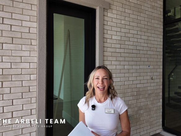 Amy Arbeli at the entry of a multigenerational new construction home in Summerlin West