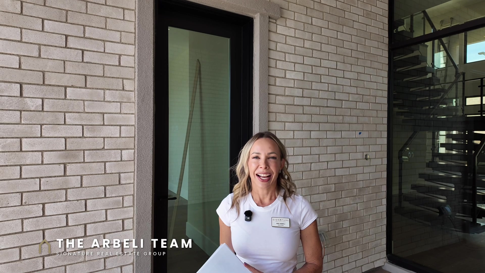 Amy Arbeli at the entry of a multigenerational new construction home in Summerlin West