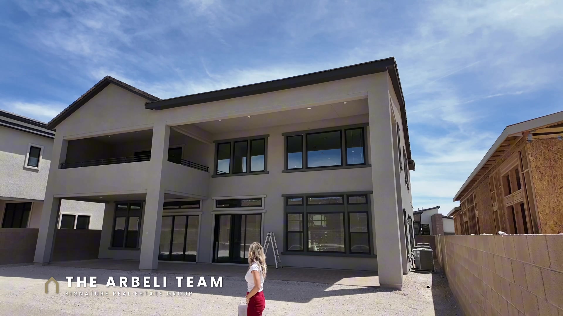 Two-story covered patio on multigenerational new construction in Grand Park, Summerlin West