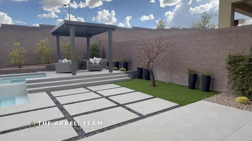 Resort backyard with pool, spa, and covered cabana at a Redpoint Summerlin Las Vegas home