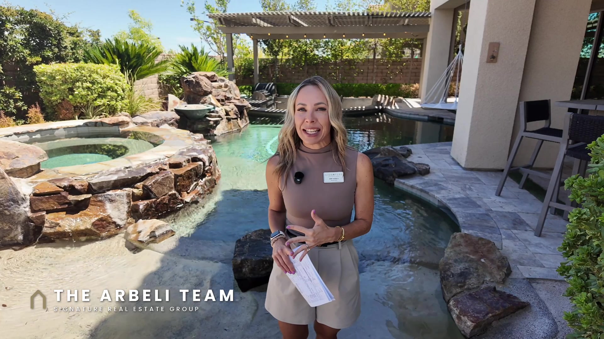 Amy Arbeli poolside on the Summerlin West luxury home tour
