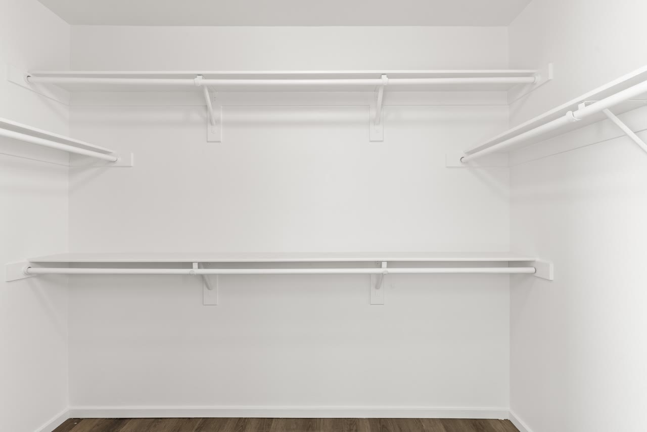 Primary walk-in closet with tiered hanging rods at 4655 Gracemont Avenue, Blue Diamond Ranch