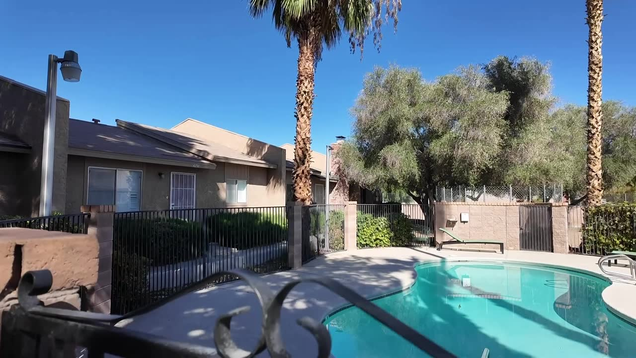 Community pool steps from the front door at 4274 Rollingstone Drive, Las Vegas home under $250K with HOA that covers the pool