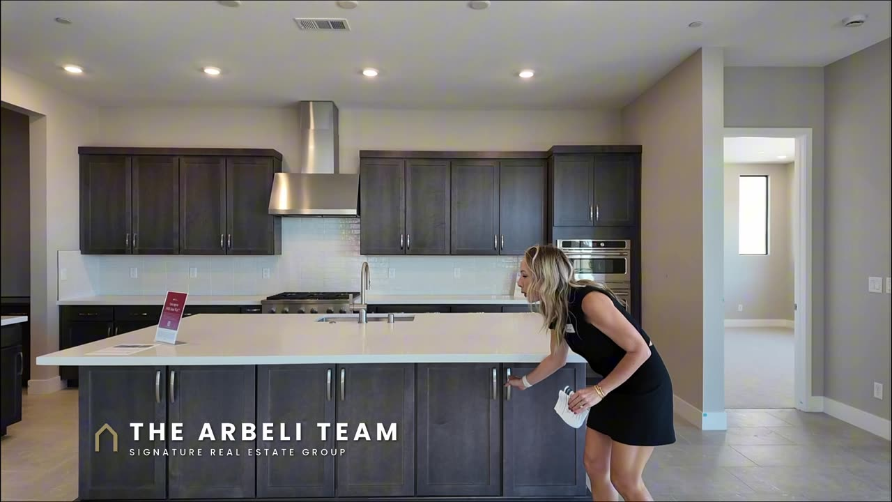 Kitchen with a large island and GE Cafe appliances in the Colonial at Ashland at Summerlin, new construction Las Vegas