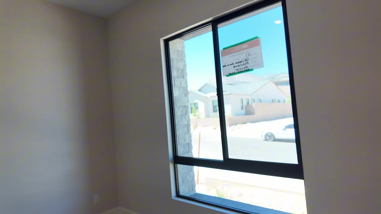 Bedroom with two windows in the new construction Summerlin home with the $249,000 price cut, Ashland at Summerlin