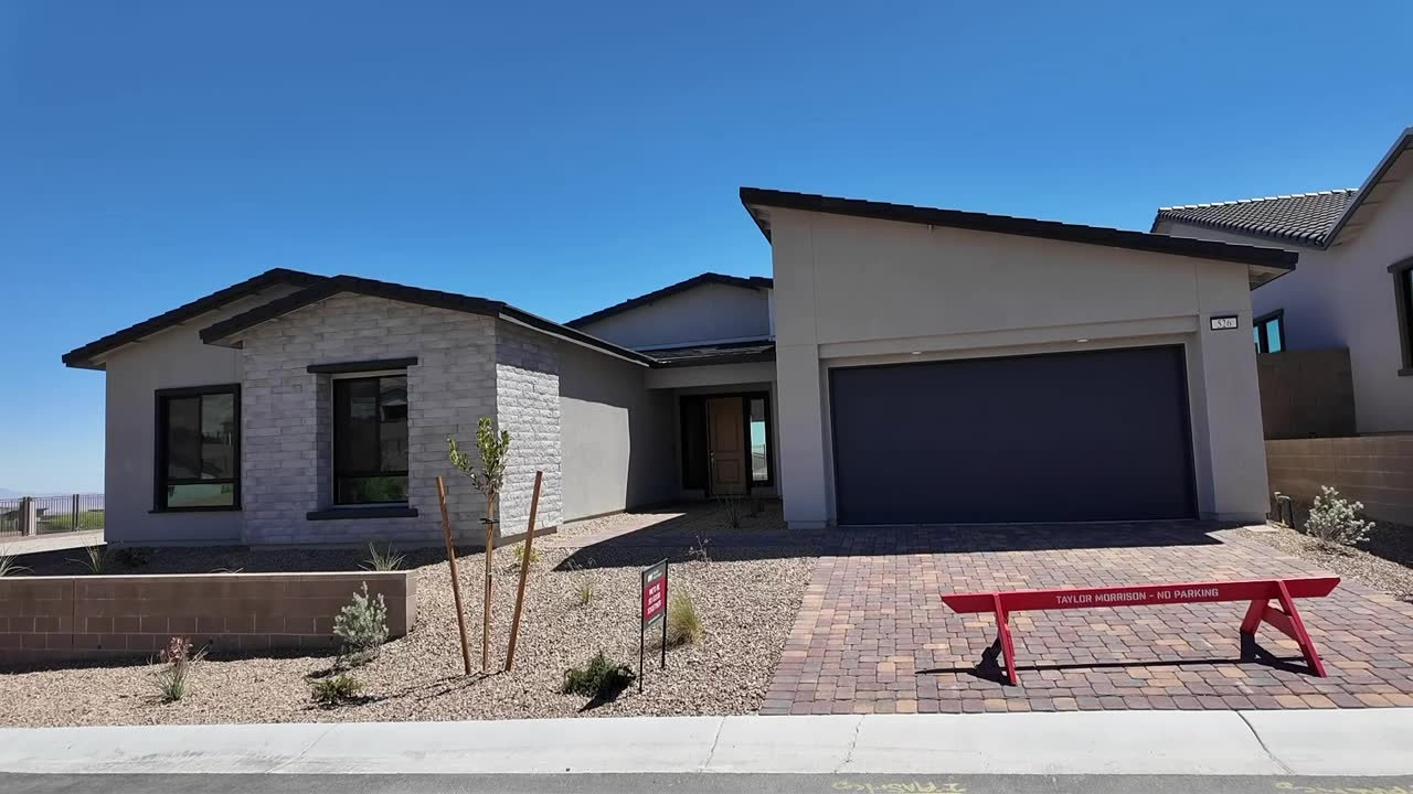 Paver driveway and three-car tandem garage on the new construction Summerlin home with the $249,000 price cut, Ashland at Summerlin