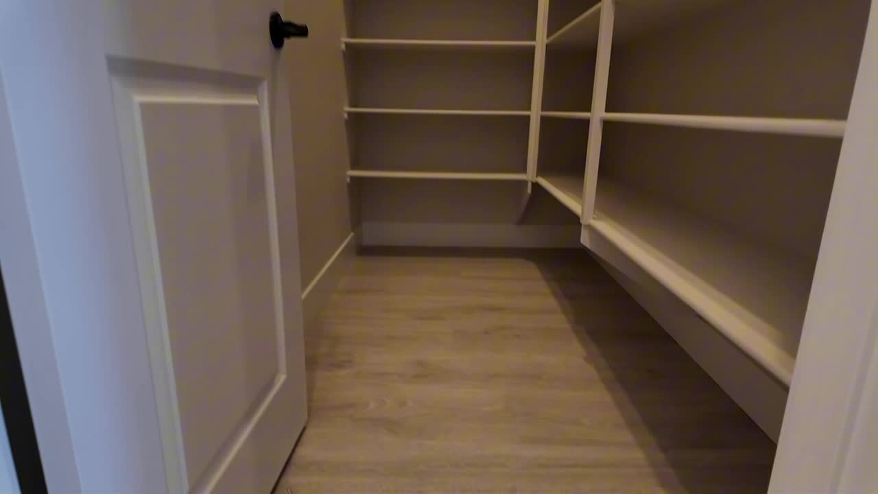 Walk-in pantry with built-in shelving in the new construction Summerlin home with the $249,000 price cut