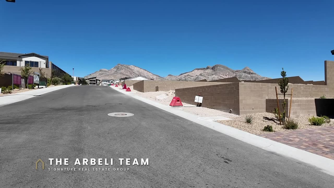 Grand Park street with mountain views outside the Colonial at Ashland at Summerlin, new construction Summerlin West