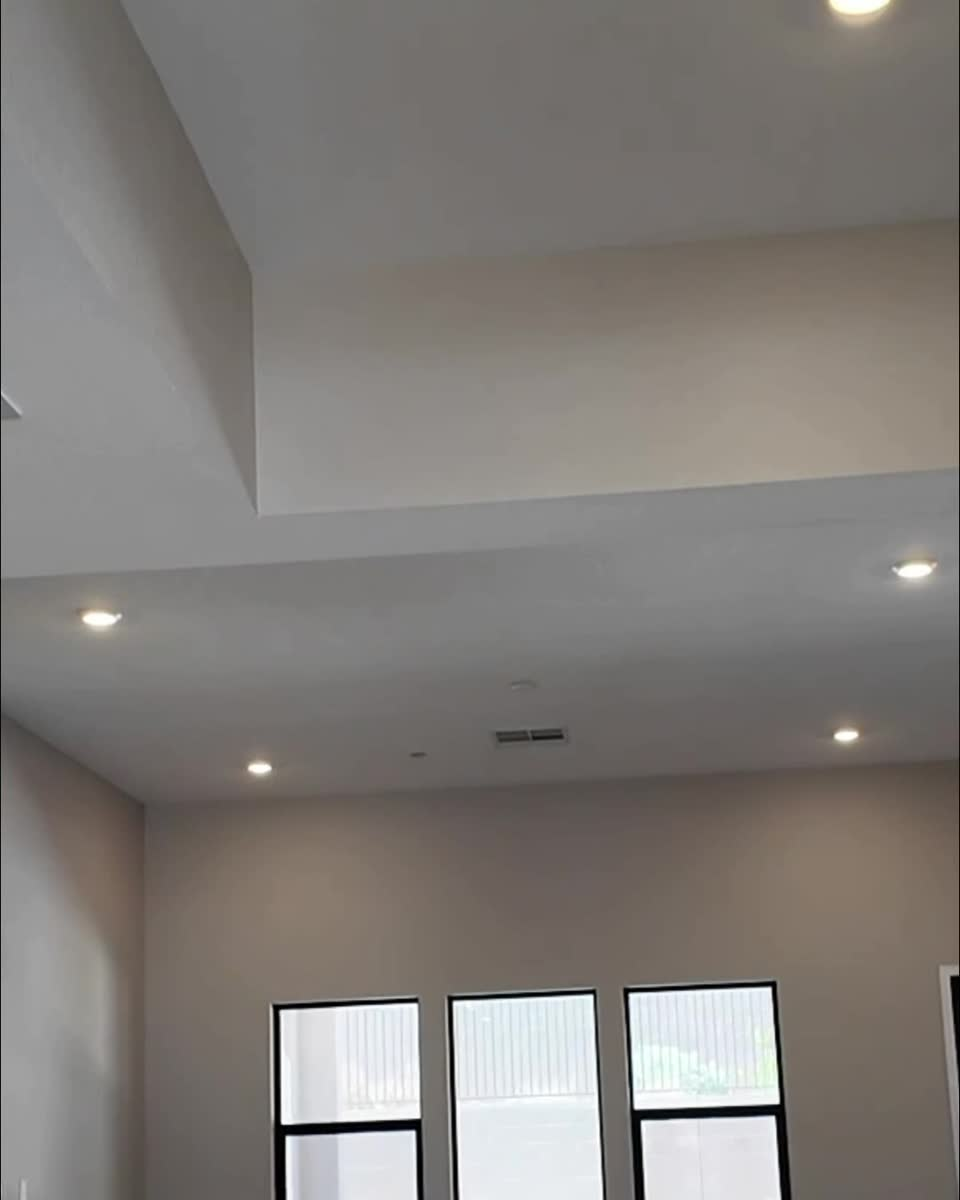 Great room with three windows over the backyard in the Liberty at Ashland at Summerlin