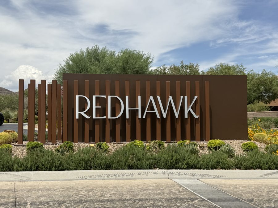 Stone entry monument reading Redhawk at the gated entrance to the Redhawk enclave inside The Ridges in Summerlin, Las Vegas, Nevada