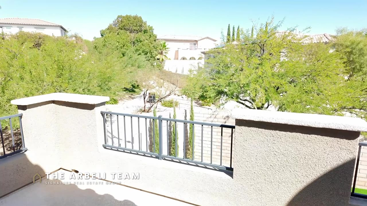 View from the primary balcony over the walking trail with no rear neighbors, Summerlin West 89138