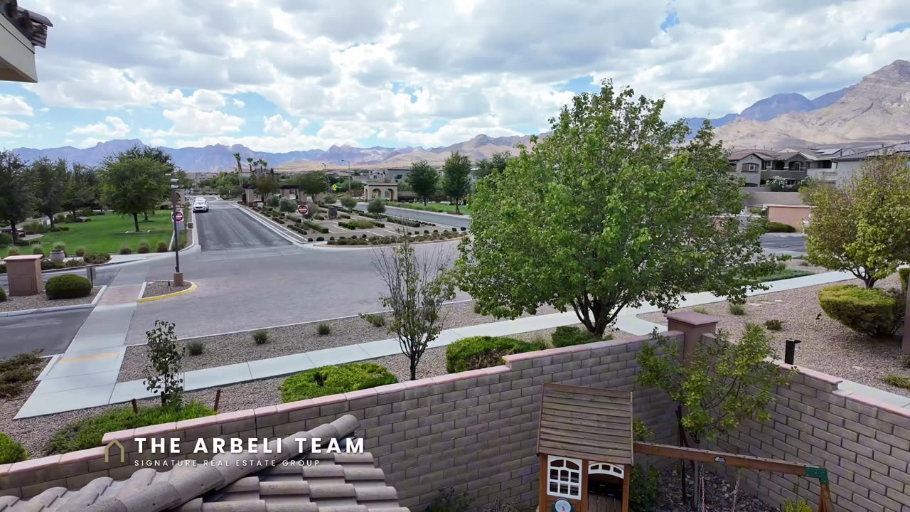 Mountain views from the upstairs balcony of a Paseos Summerlin home on a corner lot in Summerlin West