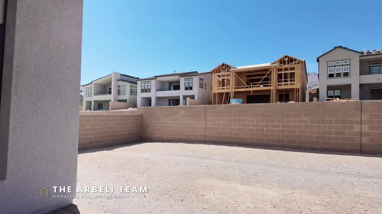 Unlandscaped backyard with block fencing on a move-in ready single story Summerlin home