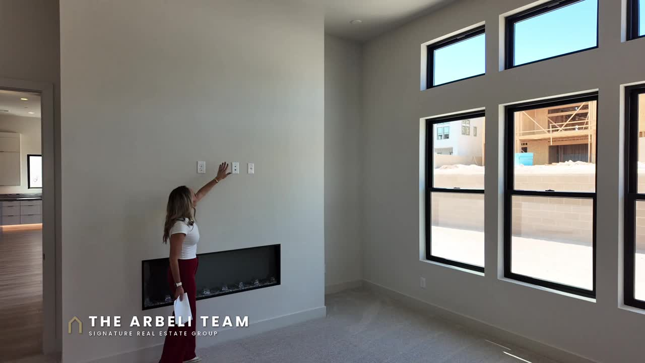 Primary bedroom with fireplace in a Toll Brothers single story home in Glenrock Summerlin West