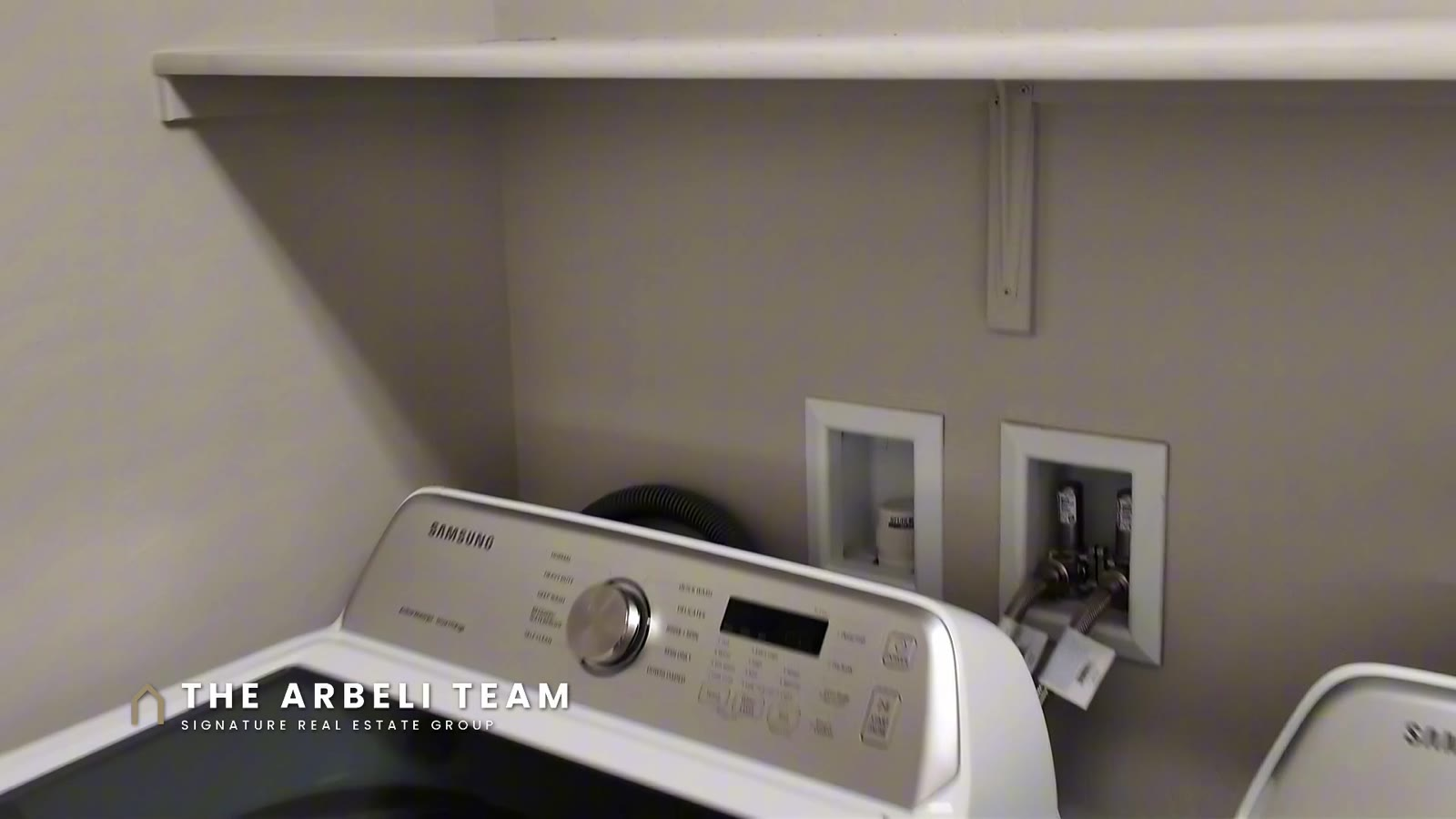 Upstairs laundry room with the included washer and dryer at 7204 Site Street, Las Vegas 89113